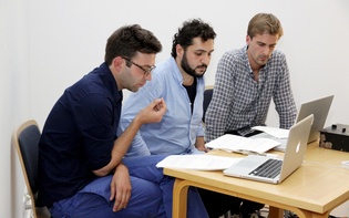 René Siegfried, Kenan Darwich, and Nils Küppers during their talk