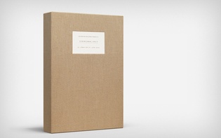 Cloth-bound box with embedded label